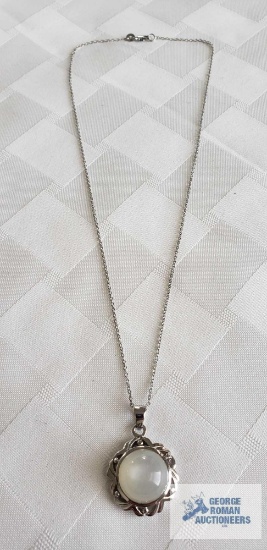 Silver colored pendant with faux moonstone (no markings found) on silver colored chain marked 925