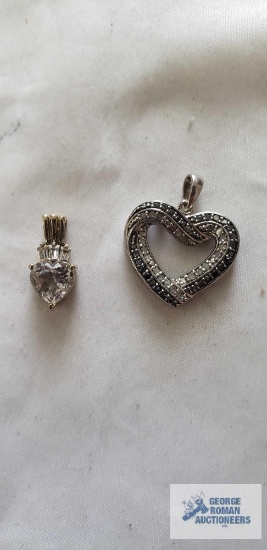 Silver colored heart pendant with clear and black stones and silver color pendant with clear stone,