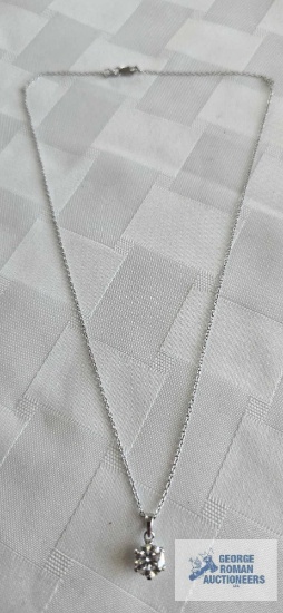 Silver colored pendant with large clear gemstone and a half carat on silver color chain, both marked
