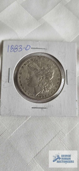 1883 Morgan dollar coin marked O