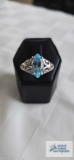 Silver colored ring with blue topaz stone, marked 925, approximately 4.2 G, size 10