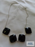 Silver colored black stone necklace. Piece has been added on which is marked 925.