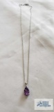 Silver colored pendant with purple stone, marked 925 on the silver colored chain, marked 925, 2.9 G.