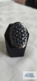 Silver colored ring with blue stones, marked 925 (marcasite), approximately 9.5 G, size 7