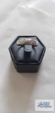 Silver colored ring, marked 925 with three clear gemstones (seller description diamonds), 3 G, size