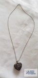 Silver colored heart-shaped locket silver colored chain, both marked 925, 9.3 G