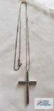Silver cross pendant, marked INOX 925, on silver colored 20