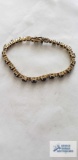 Gold colored bracelet with blue and clear stones (seller description sapphire and diamond), marked