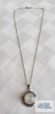 Silver colored pendant with faux moonstone (no markings found) on silver colored chain marked 925