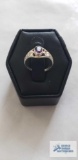 Silver colored ring with purple stone, marked 10K, 1.2 G, size 2.5