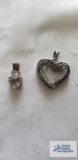 Silver colored heart pendant with clear and black stones and silver color pendant with clear stone,