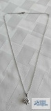 Silver colored pendant with large clear gemstone and a half carat on silver color chain, both marked