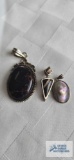 3 silver colored pendants with stones, marked 925
