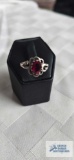 Silver colored ring with red stone, marked. SS925, 2.5 G, size 7