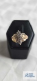 Gold colored ring with clear stones marked 10K. (Seller description is total weight diamond) 4.0G,