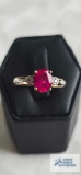 Two tone ring with red stone and diamond, marked 10K, 2.34 G, size 7