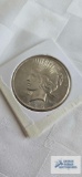 1925, uncirculated peace dollar coin.