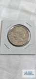 1923uncirculated peace dollar coin, marked D