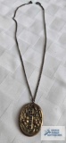 Antique gold colored floral and cross locket marked SBL Co Fribes (seller description gold filled)