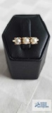 Gold colored ring with 3 pearls, 2.9 G, marked 10K, size 4.5