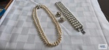 Pearl like double strand necklace with clear stones, clasp marked H with matching earrings. One