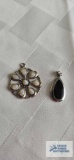 Silver colored white stone floral pendant, marked 925 and black stone pendant, no marking found