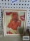 Cardboard framed photograph under glass