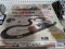 Aurora AFX racing slot car track with extra cars and box