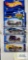 Three of the 2002 Redline Hot Wheels cars and one 2001 Extreme Sports series Hot Wheels car, new in