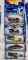 One 2000 CD Customs series Hot Wheels car, two 2000 Secret Code series Hot Wheel cars and Two 2000