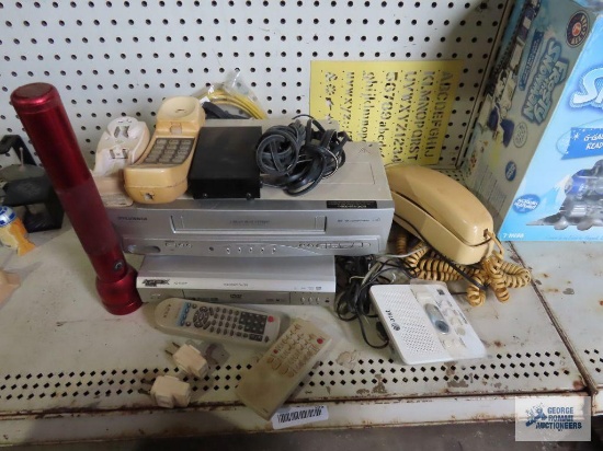 Apex DVD player, Sylvania VHS player, telephone, Maglite and other electronic pieces