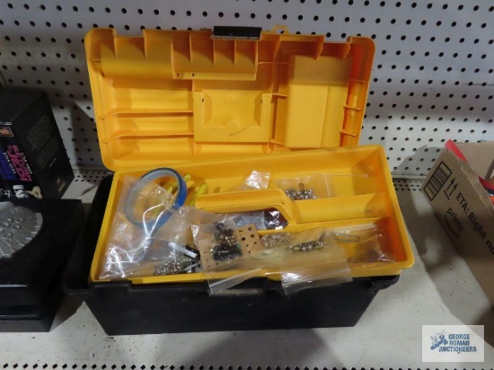 Plastic toolbox with various computer parts and pieces