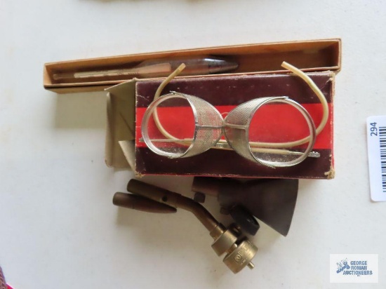 Vintage safety glasses, thermometer, and Bernzomatic torch ends