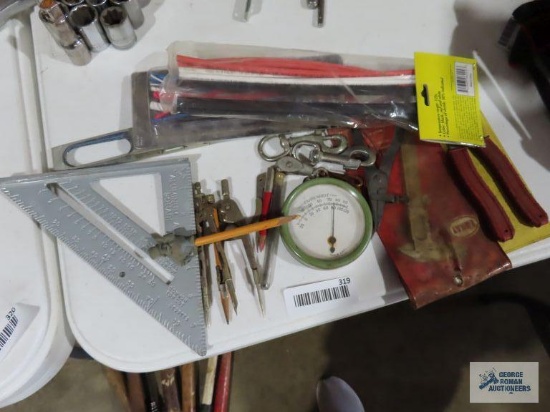 Speed square, heat shrink tubing, vintage thermometer, machinist caliper, snap ring pliers, etc