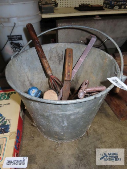 Metal bucket with assorted tools