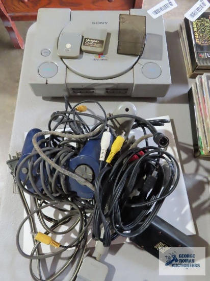 Sony PlayStation with two controllers, RCA jack connector, two memory cards and power cord