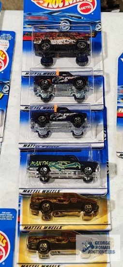Complete set of 2000 Action Pack series Hot Wheel cars new in packages with extras
