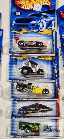One 2000 CD Customs series Hot Wheels car, two 2000 Secret Code series Hot Wheel cars and Two 2000