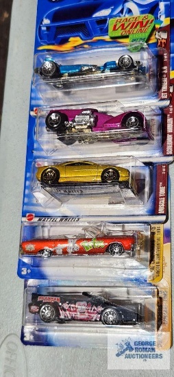 Three of the 2002 Spectra Flame Hot Wheels cars and two of the 2004 Cereal Crunchers Hot Wheels