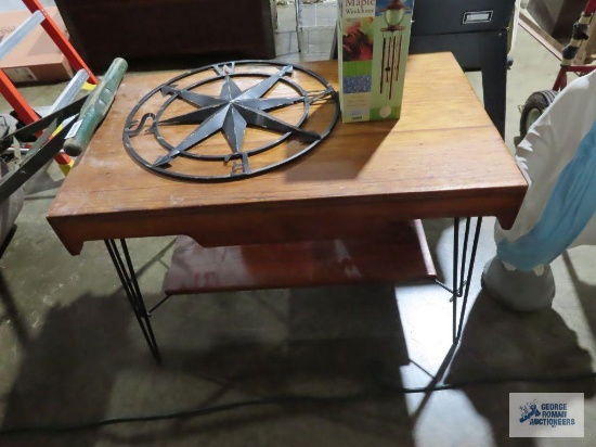 Wooden table with wrought iron legs