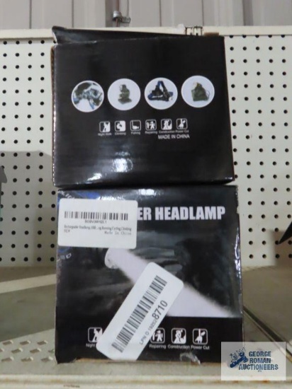 Pair of power headlamps in boxes