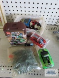 Assorted Legos and toy cars and plastic army men