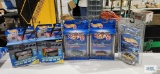 Hot Wheels cars, three Final Run and two Cyber Racers, new in packages
