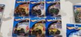 Six Hot Wheels Monster Jam monster trucks new in packages including Grave Digger, Sting, Predator,