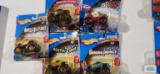 Five Hot Wheels Monster Jam trucks new in packages including Wild Thing, Airborne Ranger,