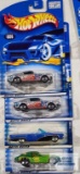 four 2001 hippie mobile series Hot Wheels cars new in packages