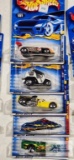 One 2000 CD Customs series Hot Wheels car, two 2000 Secret Code series Hot Wheel cars and Two 2000