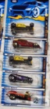 2000 Hot Rod Magazine series and two 2001 Skull and Crossbones series Hot Wheels cars, new in