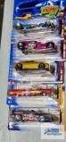 Three of the 2002 Spectra Flame Hot Wheels cars and two of the 2004 Cereal Crunchers Hot Wheels