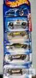 One 2003 Radical Wrestlers Hot Wheels cars and four 2004 Pride Rides Hot Wheels cars, new in